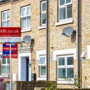 For Sale signs outside a English townhouse For sale signs outside house